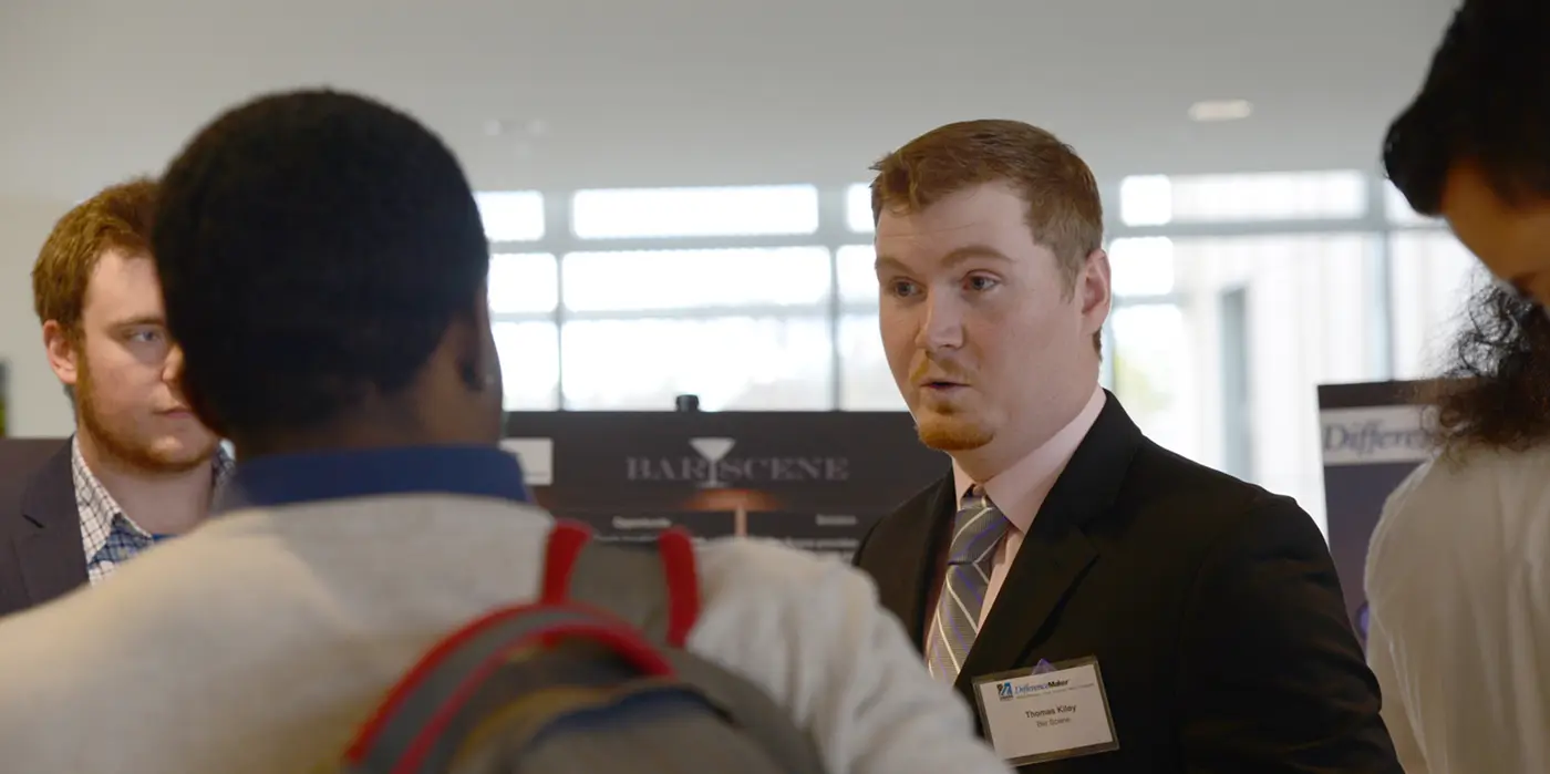 Thomas Kiley delivers a rocket pitch for Bar Scene at the DifferenceMaker Idea Challenge