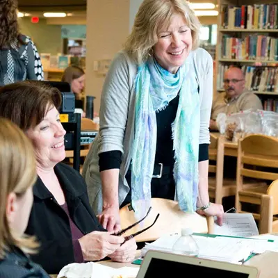 women collaborating around a table