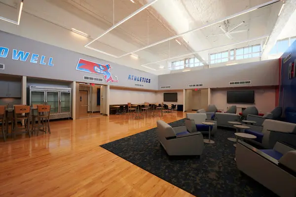 Chairs, tables and refrigerators in the new team lounges at Costello Athletic Center