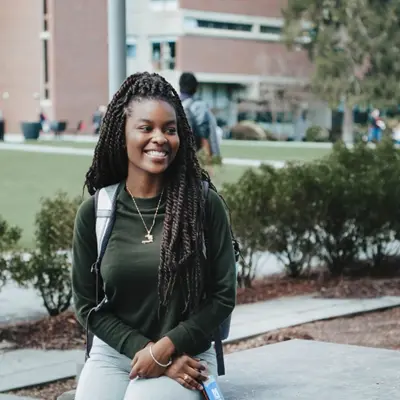 female student sitting on south campus