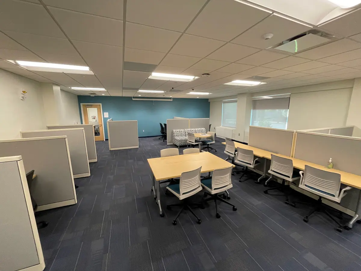 A room with several desks and work stations.