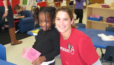 UMass Lowell student in the Jumpstart Program with preschooler.