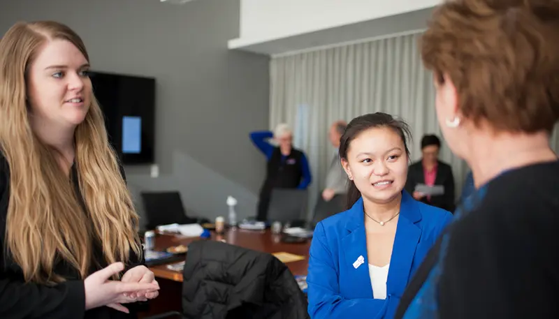 SGA President Lisa Degou and student Trustee Lindy Reed chat with Chancellor Jacquie Moloney at their monthly lunch.