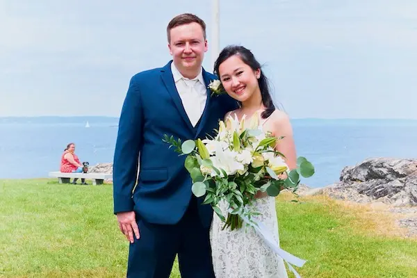 Mike Pindrus and Michelle Anggara pose for their wedding photo