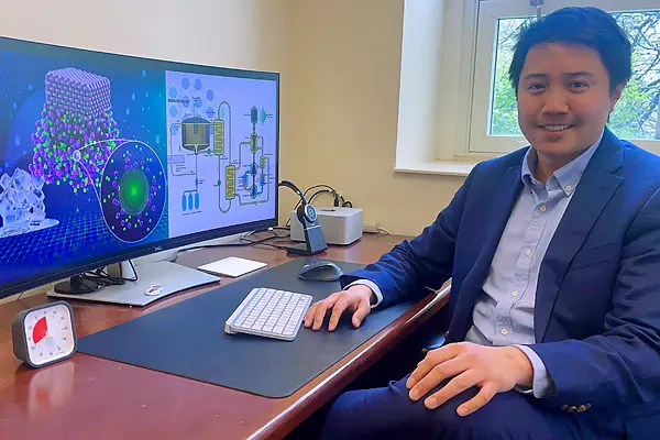 Stephen Lam at his desk