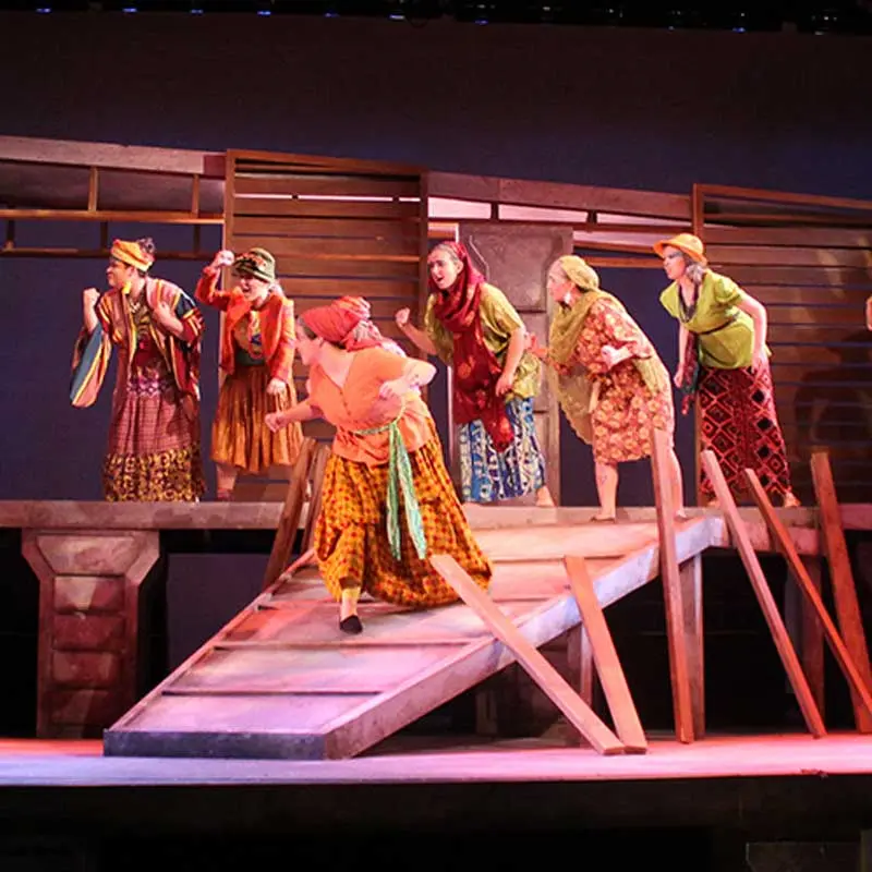 Students performing on stage during a UMass Lowell Theatre Arts production.