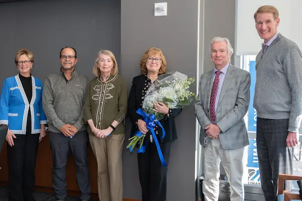 Katherine Tucker, center, surrounded by deans, chancellor and provost