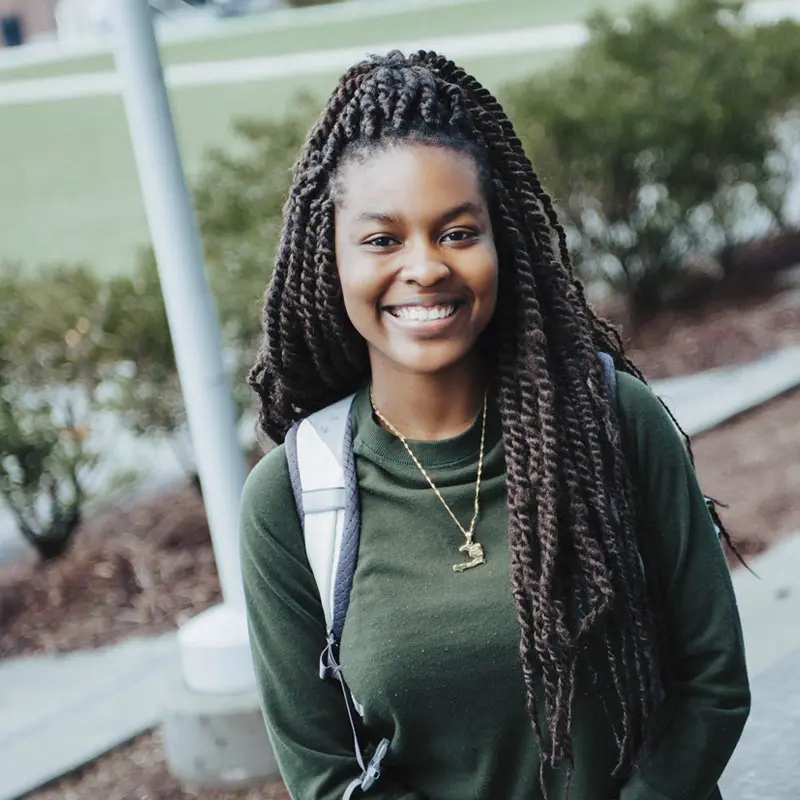 female student smiling on south campus