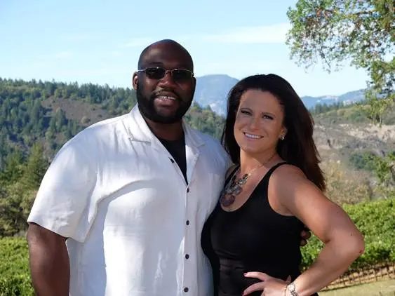 UMass Lowell alumni Brian and Amy Wint pose in front of the rolling vineyards of Napa Valley